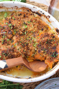 Sweet potato casserole in a white baking dish.