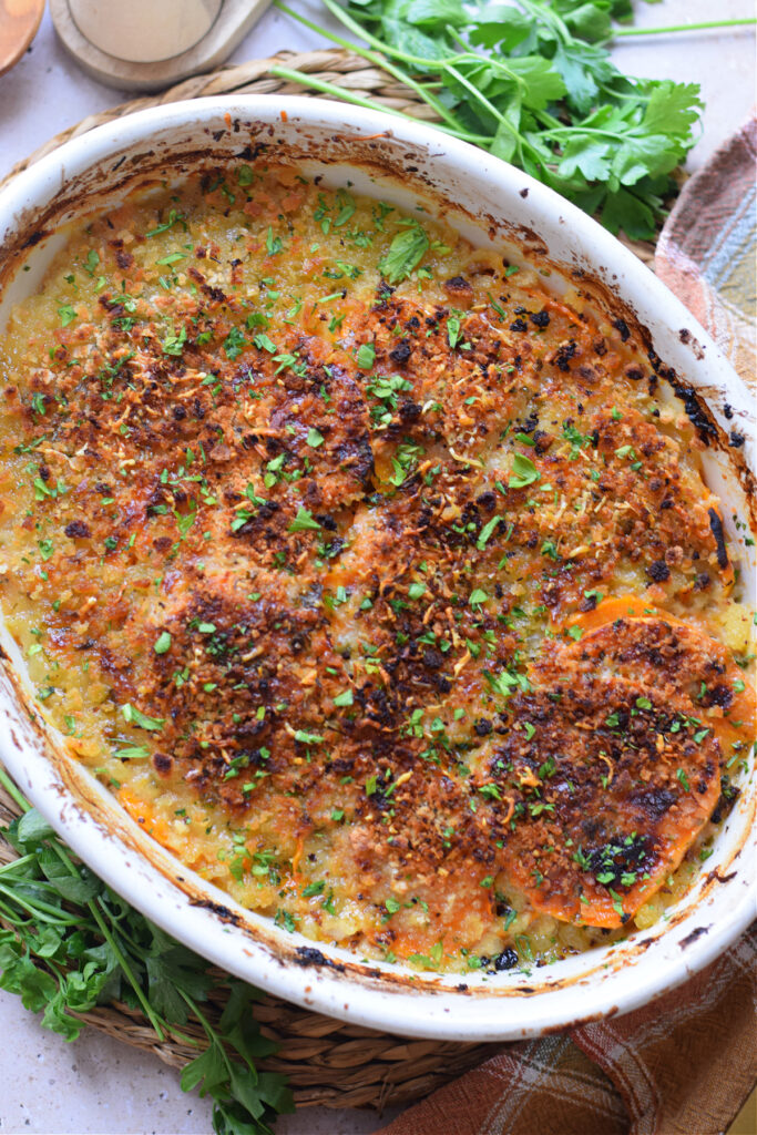 Sweet potato gratin in a white baking dish.