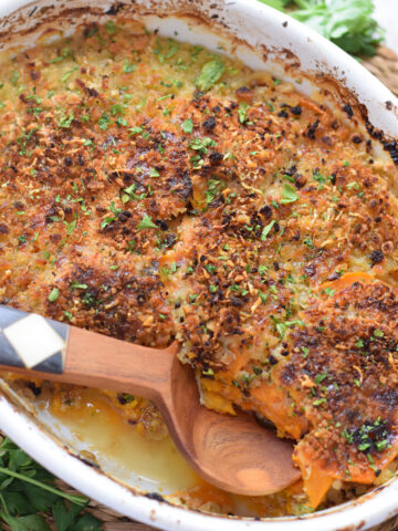 Sweet potato gratin in a white serving dish.