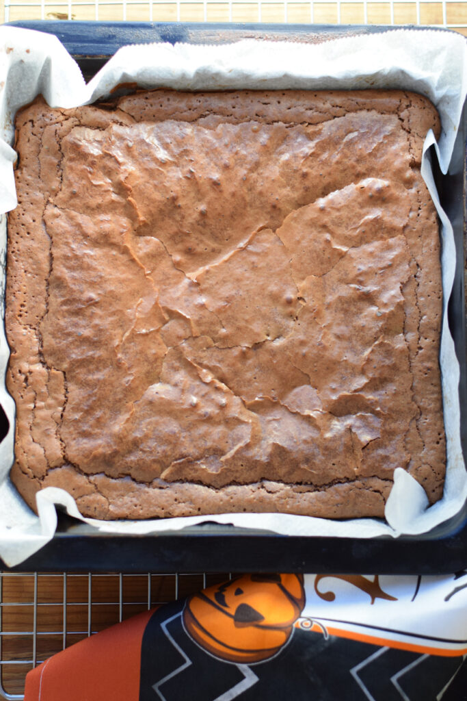 Baked brownies in a tray.