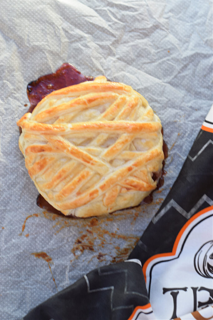 Baked puff pastry cheese wheel.