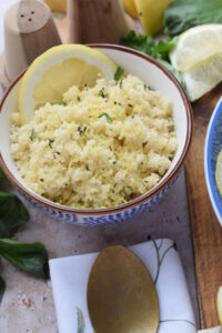 Light and fluffy couscous in a small bowl.