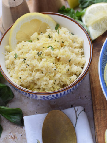 Light and fluffy couscous in a small bowl.