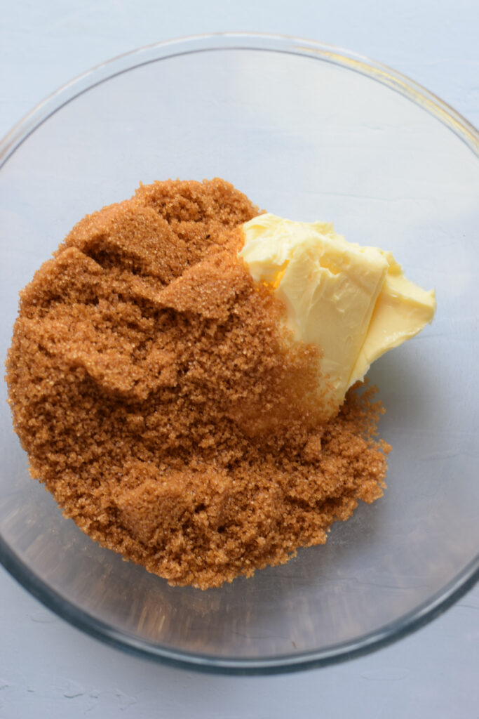 Brown sugar and butter in a glass bowl.