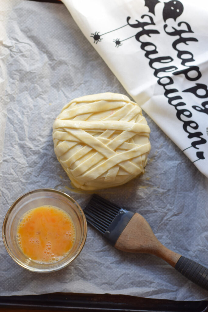 Ready to baked brie cheese covered in puff pastry.