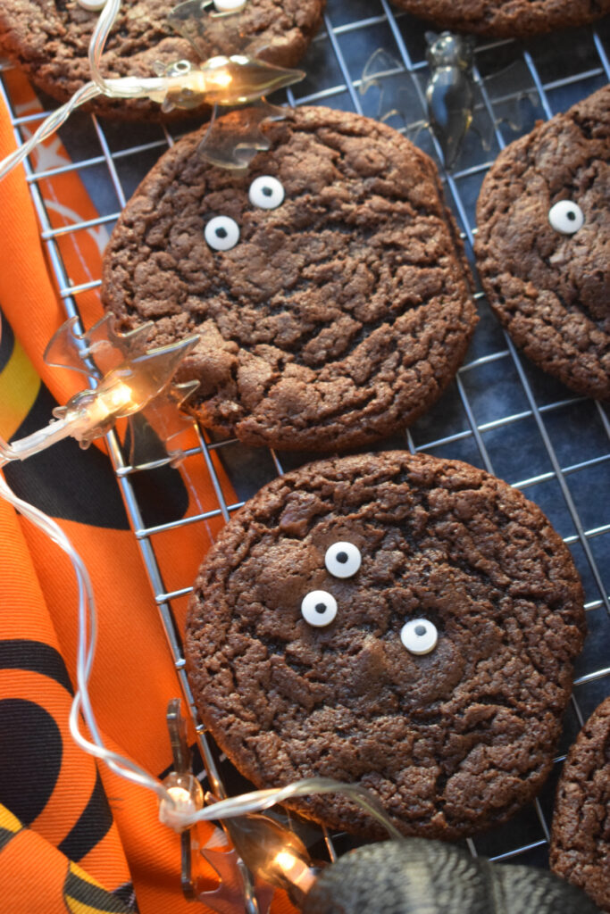 Chocolate halloween cookies with monster eyes.