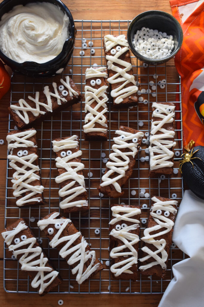 Chocolate mummy brownies on a tray.