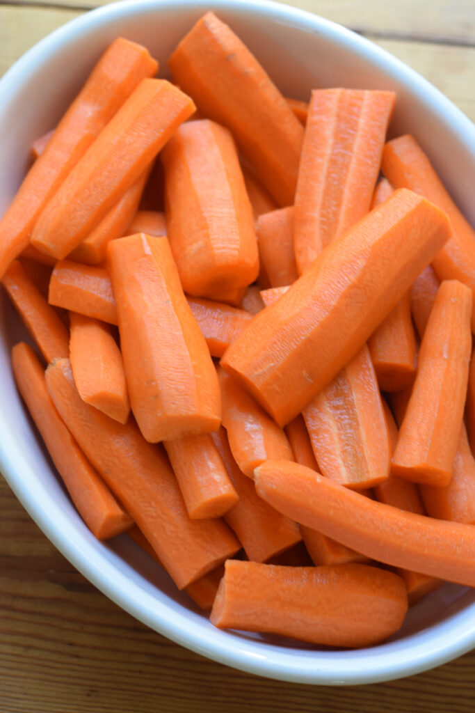 Carrots in a white dish.