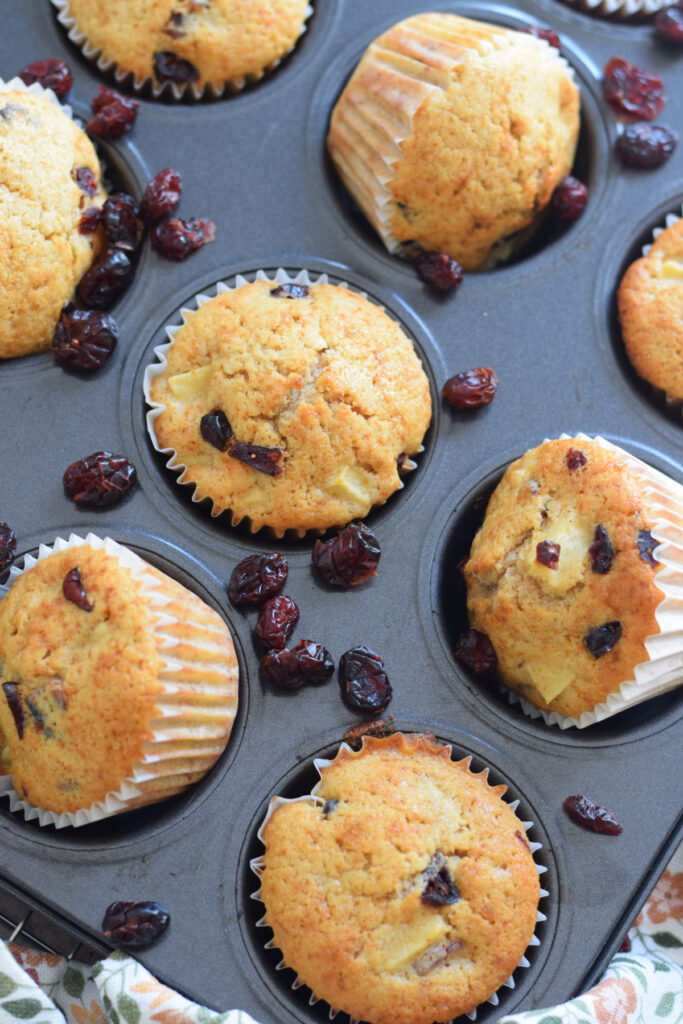 Apple cranberry muffins in a tray.