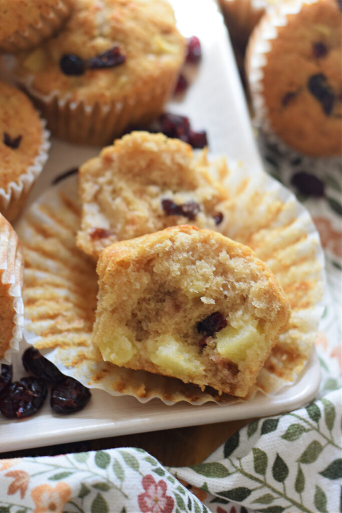 Apple cranberry muffins on a plate.