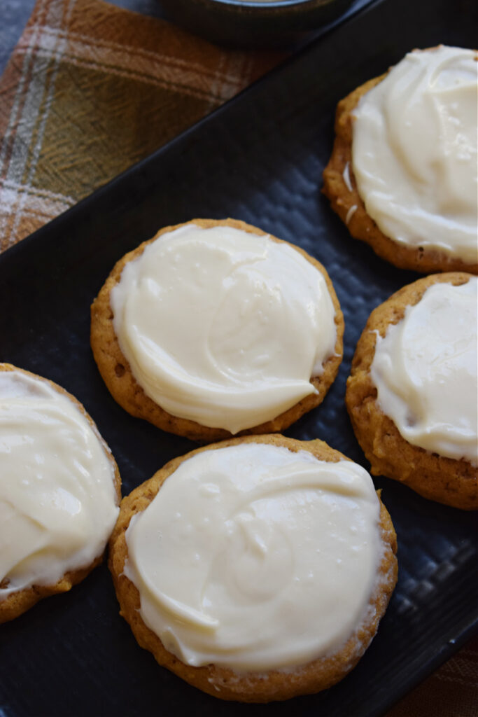 Pumpkin cookies with a cream cheese frosting.