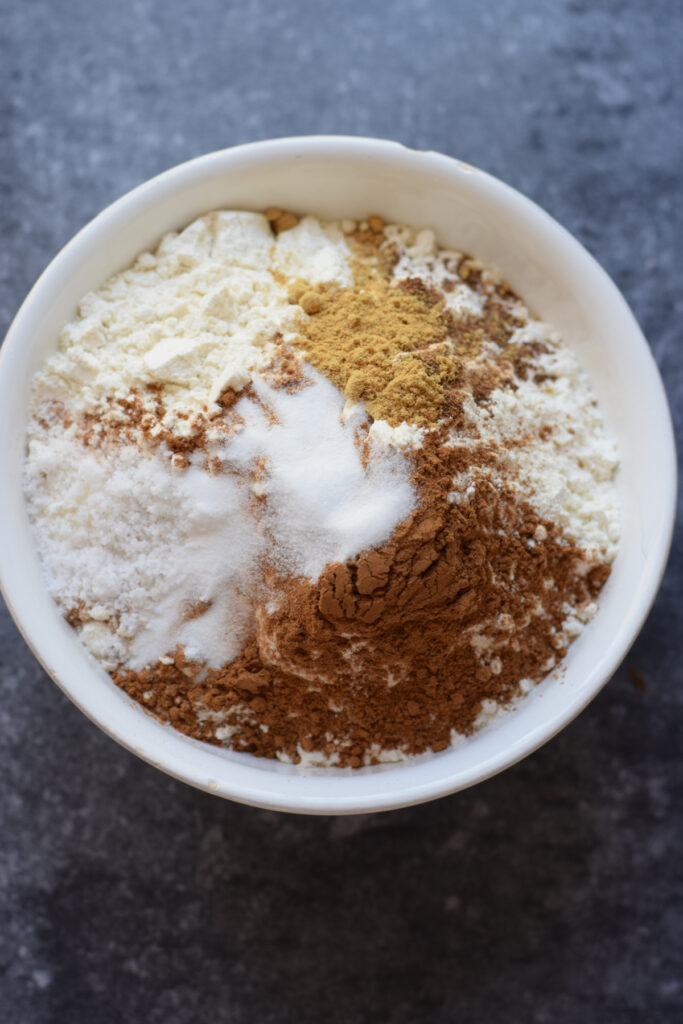 Flour and spices in a glass bowl.