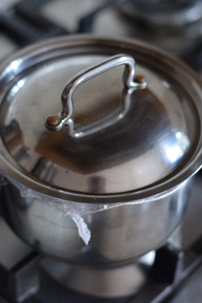 Close up of a saucepan with a lid.