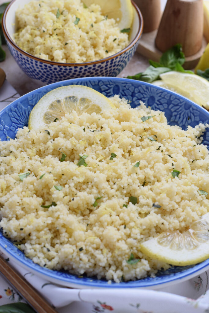 Lemon basil couscous in a blue bowl.