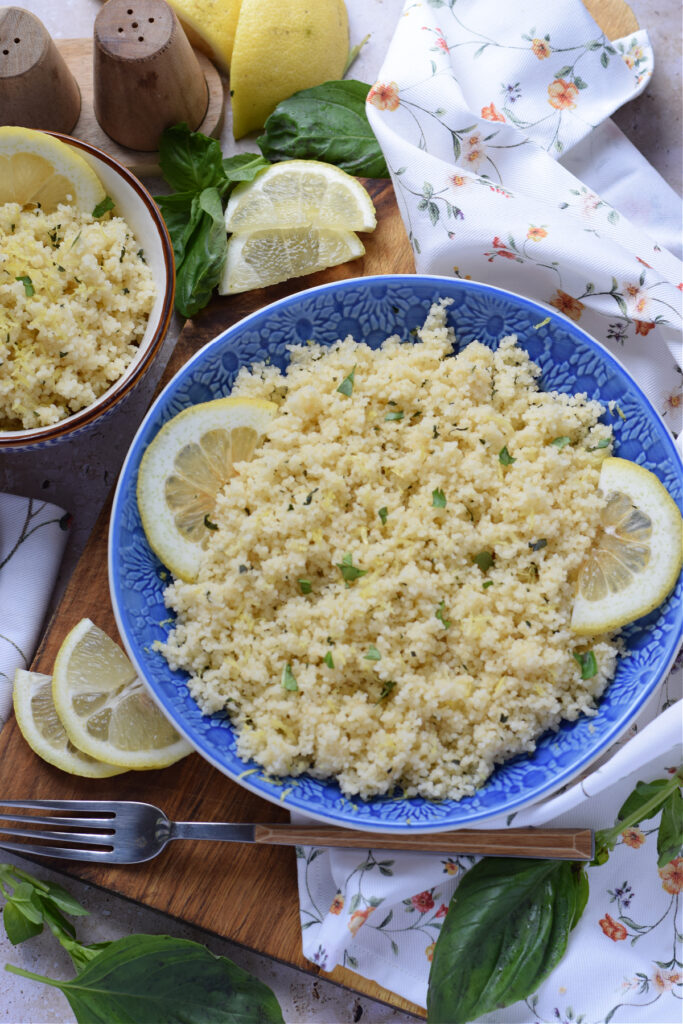 Lemon basil couscous in blue bowl.