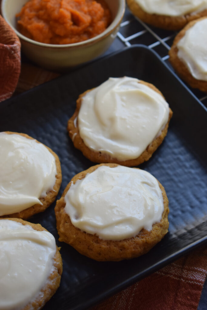 Close up of frosted pumpkin cookies.