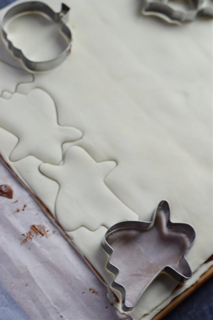 Cutting out puff pastry shapes.