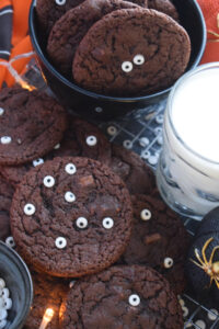 Halloween cookies with a glass of milk.