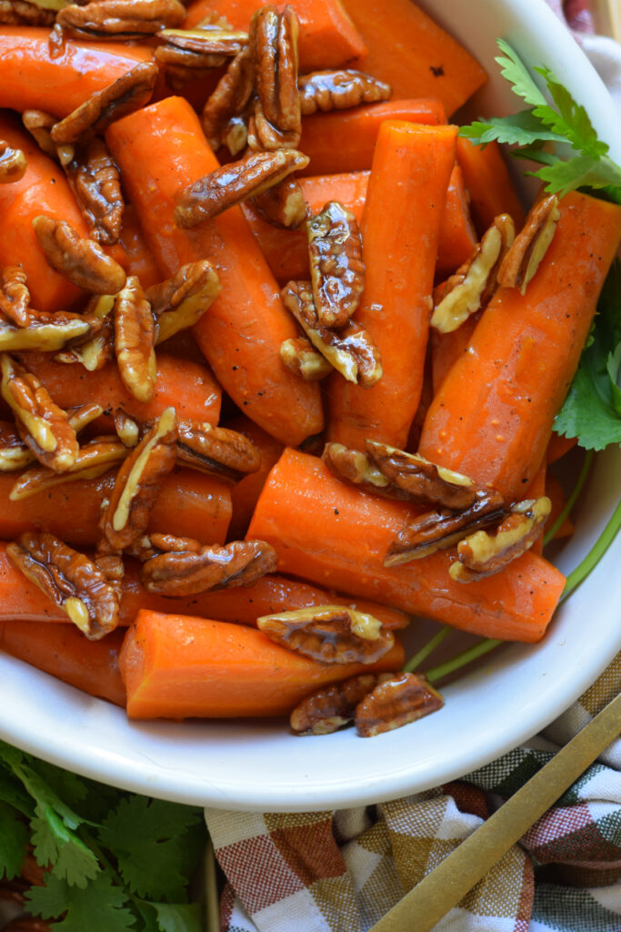 Close up of maple pecan topped carrots.