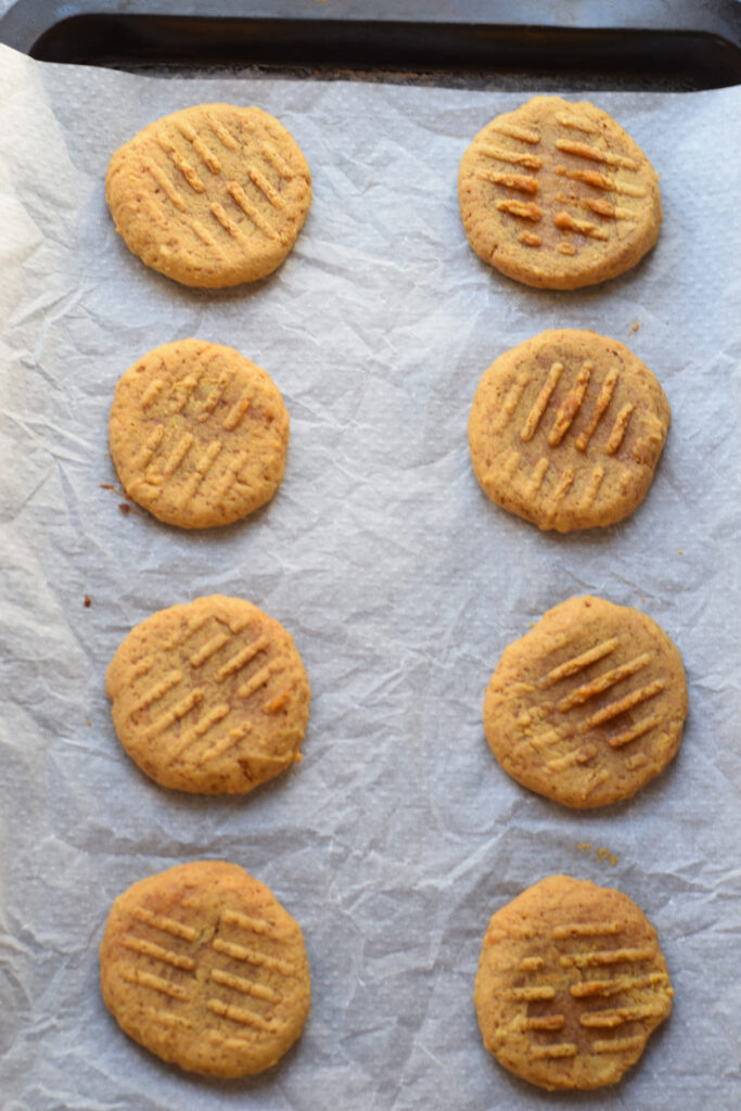 Pumpkin cookies on a tray.