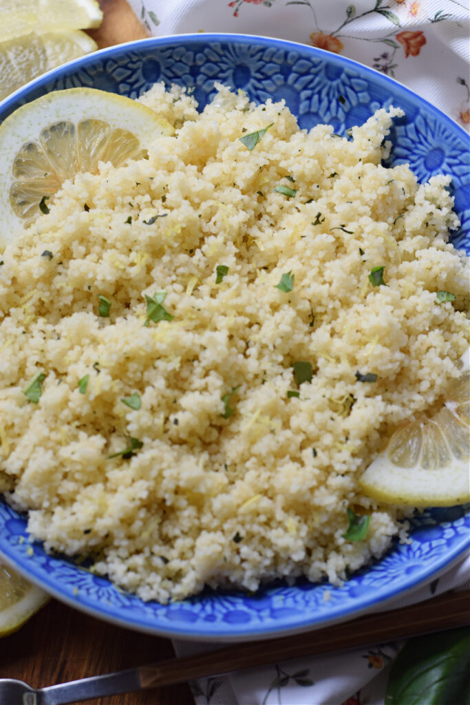 Herb couscous in a blue bowl.