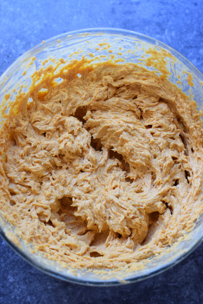 Pumpkin cookie dough in a bowl.