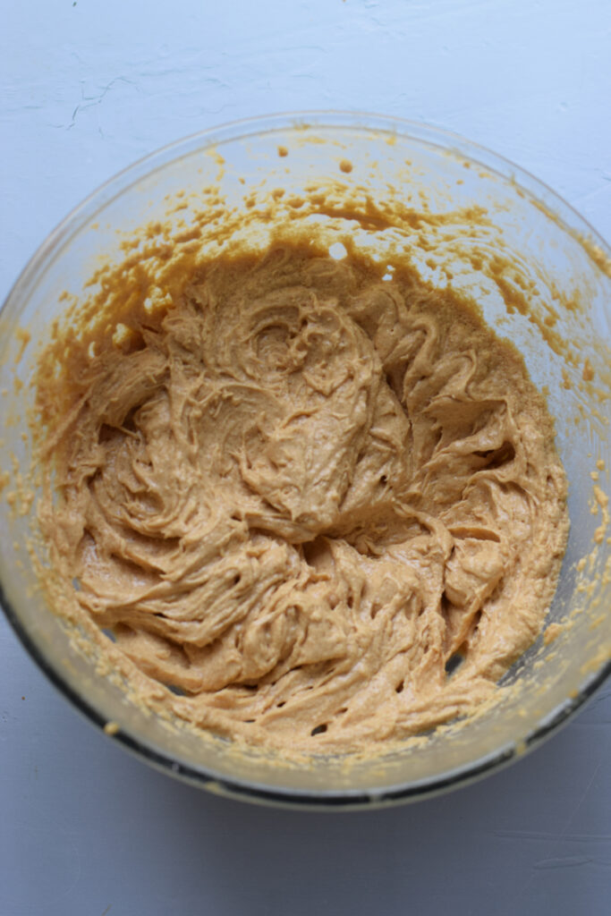 Muffin batter in a glass bowl.