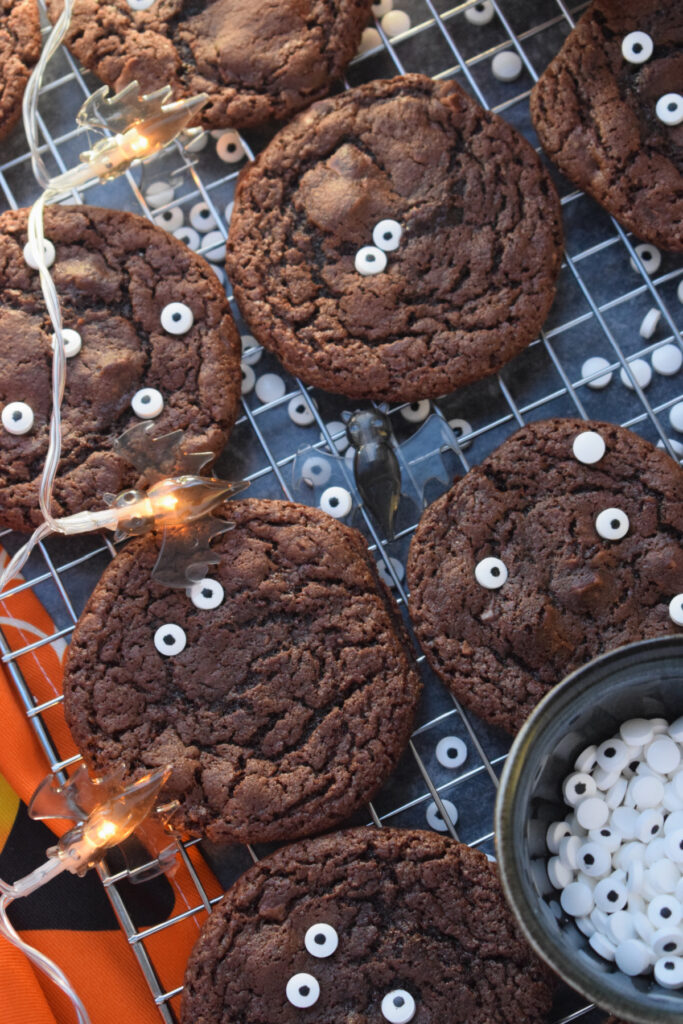 Cookies on a tray with a halloween tea towel.