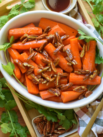 Carrots in a white dish.