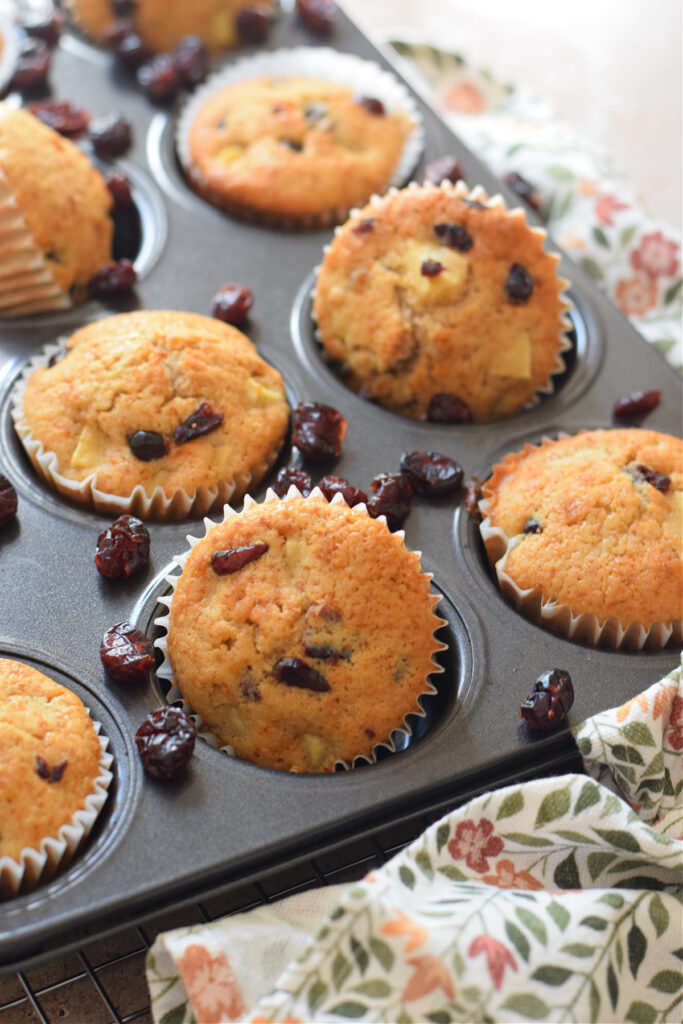 Apple cranberry muffins in a tray.