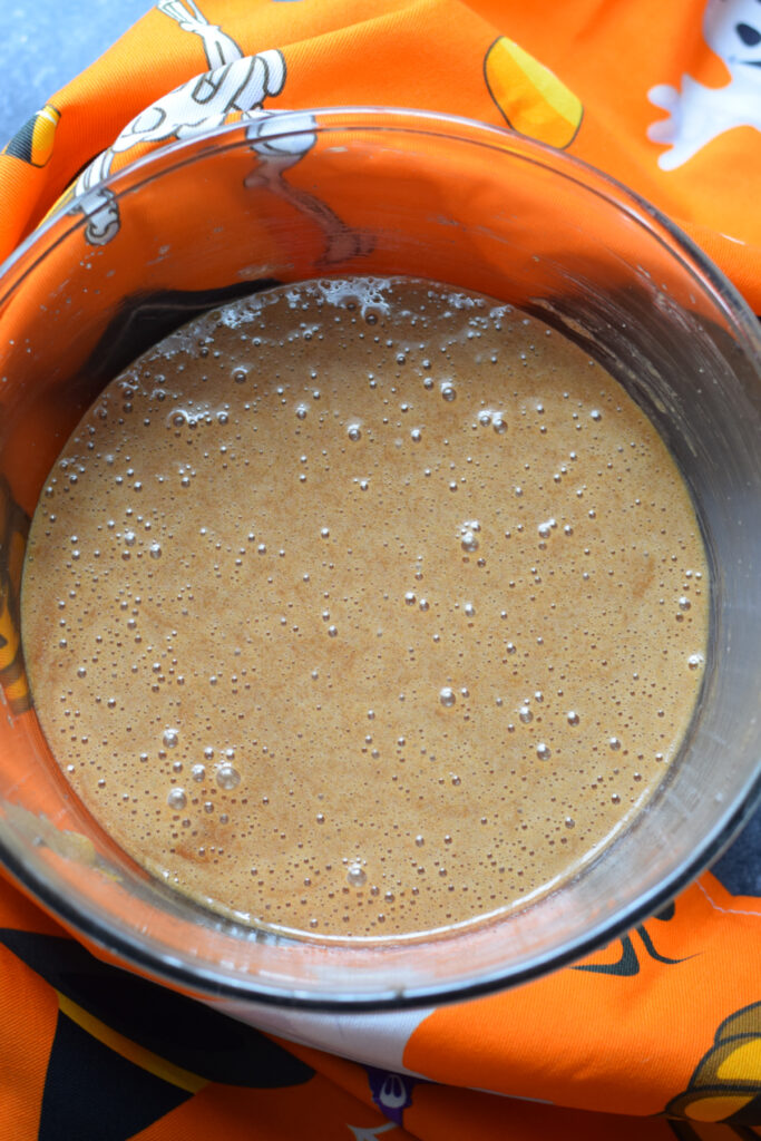 Making chocolate Halloween cookie dough.