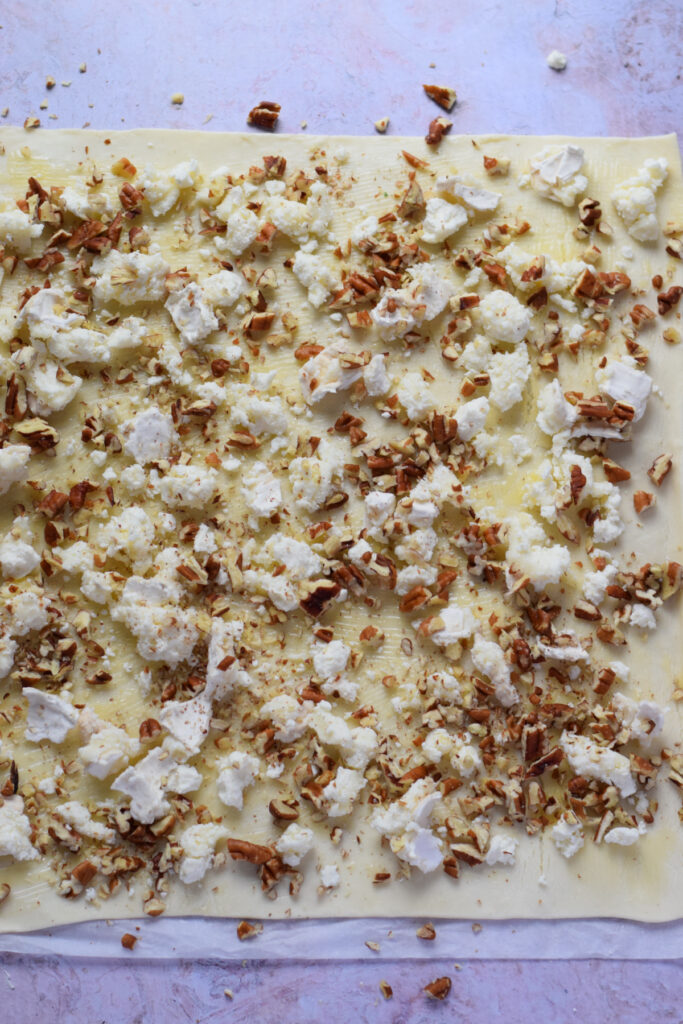 Puff pastry topped with pecans and goat cheese.