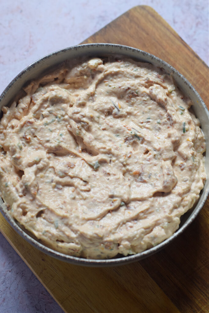 Sun dried tomato dip in a bowl.