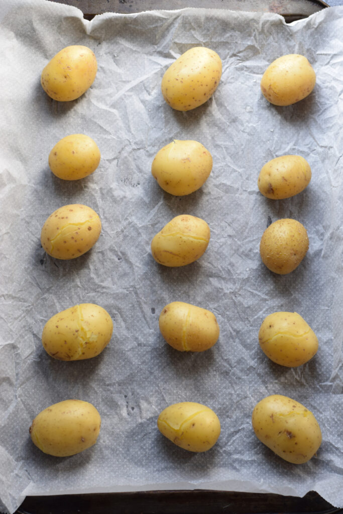 Baby potatoes on a baking tray.