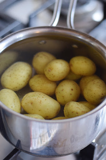 Boiling potatoes in a saucepan.