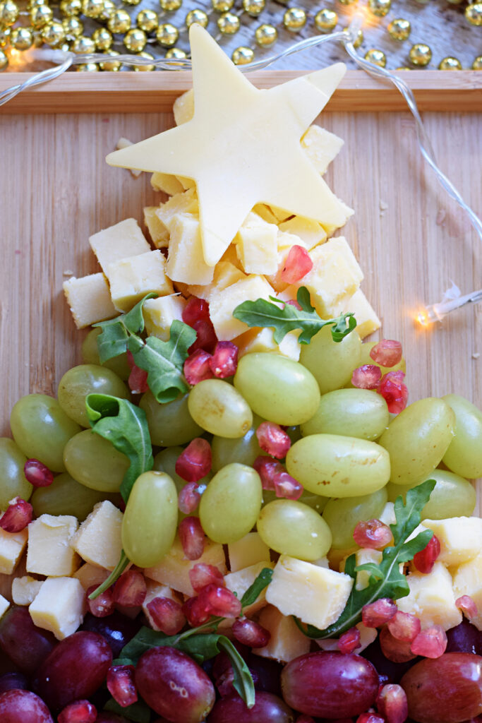 Close up of a fruit and cheese platter.