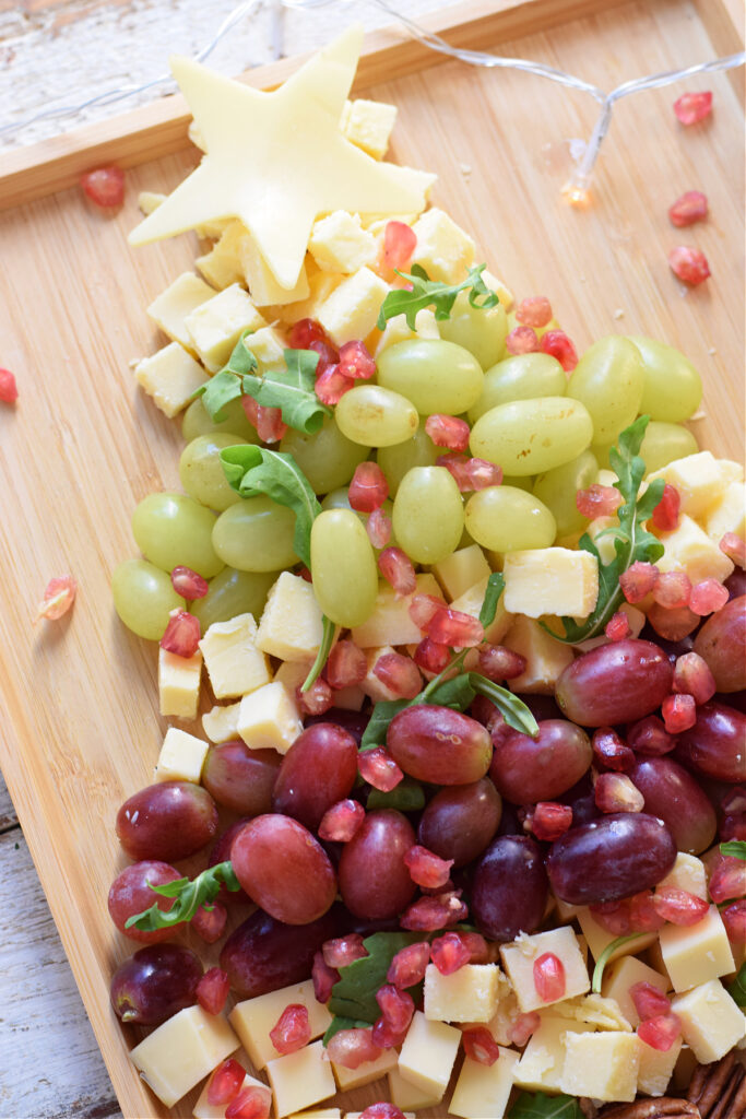 Close up of a fruit and cheese Christmas tree.