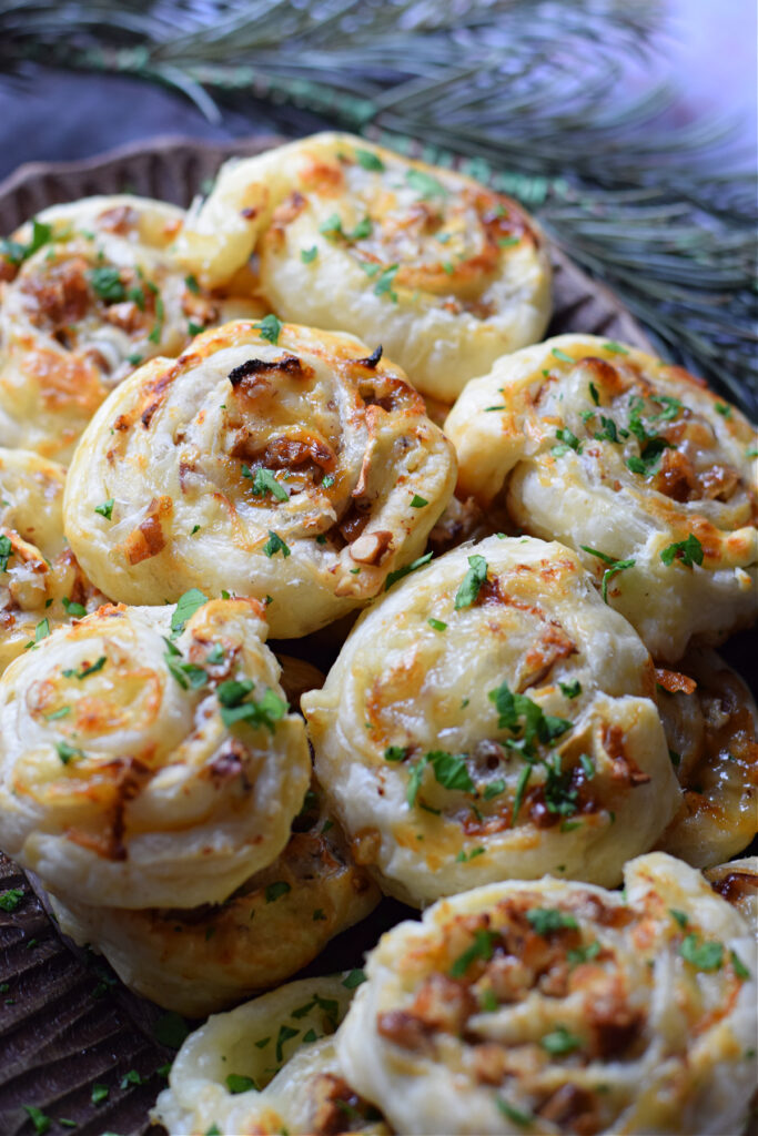 Close up of puff pastry appetizers on a plate.