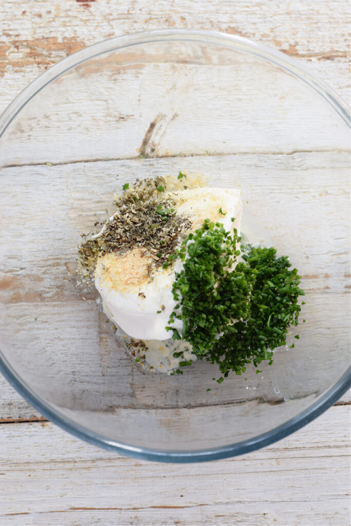 Ingredients in a bowl to make a cream cheese dip.