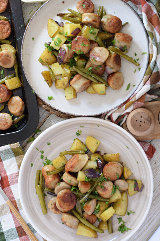 Sausage dinner on serving plates.