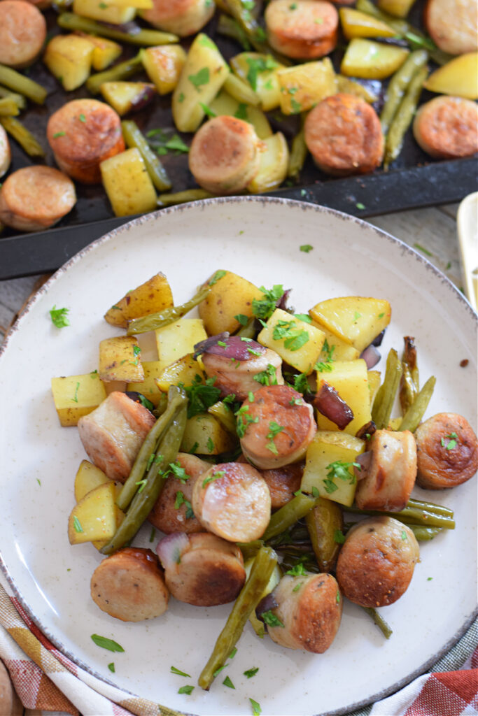 Close up of a sheet pan dinner on a plate.