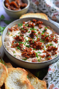 Sun dried tomato dip in a bowl.