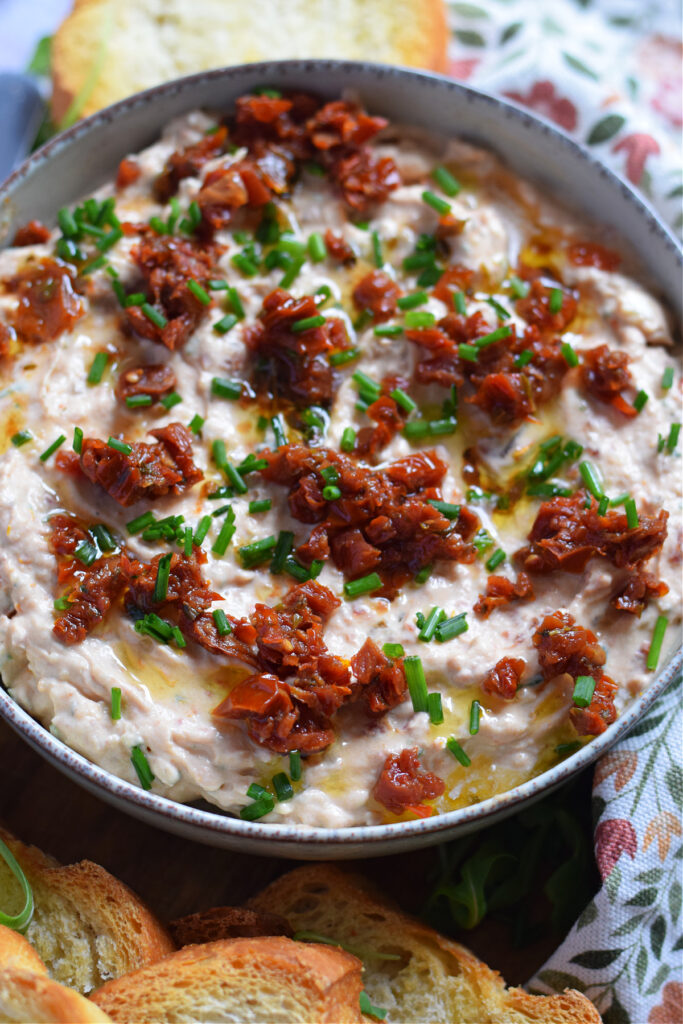 Sun dried tomato dip in a serving bowl.