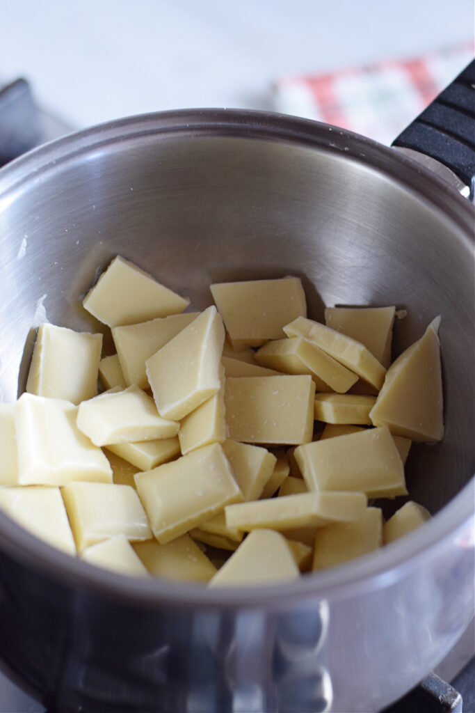 Chopped chocolate in a saucepan.