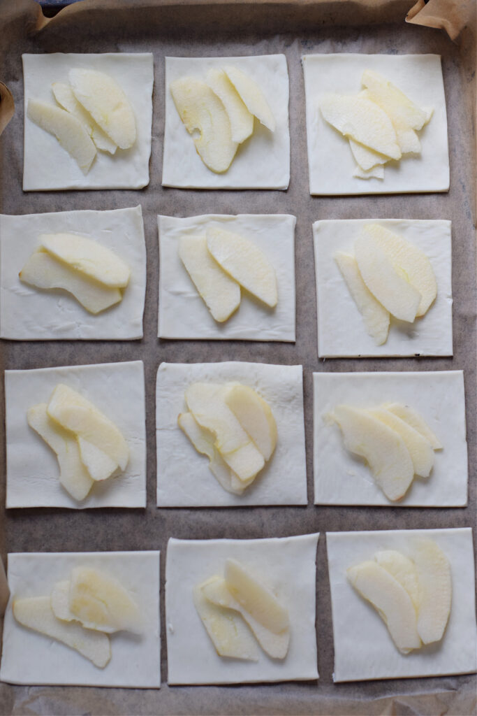 Pastry squares topped with apple slices.