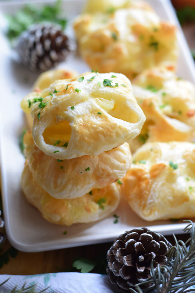 Close up of apple and brie pastry bites.