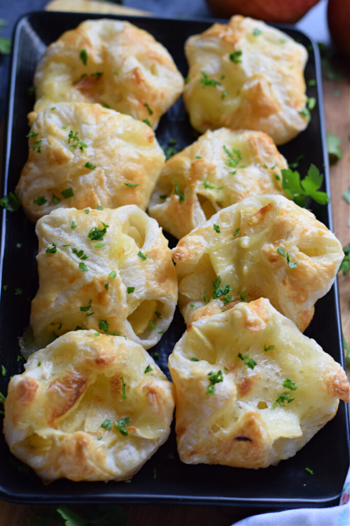 Baked apple and brie puff pastry bites.