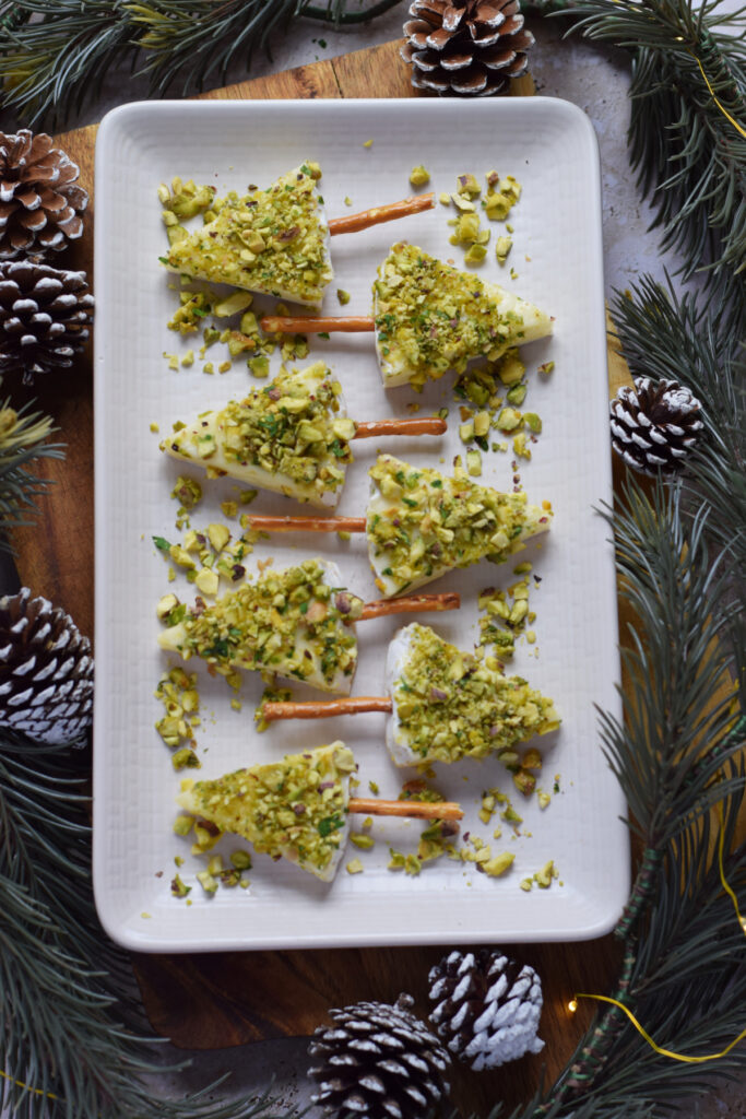 Mini Christmas tree appetizers on a white plate.