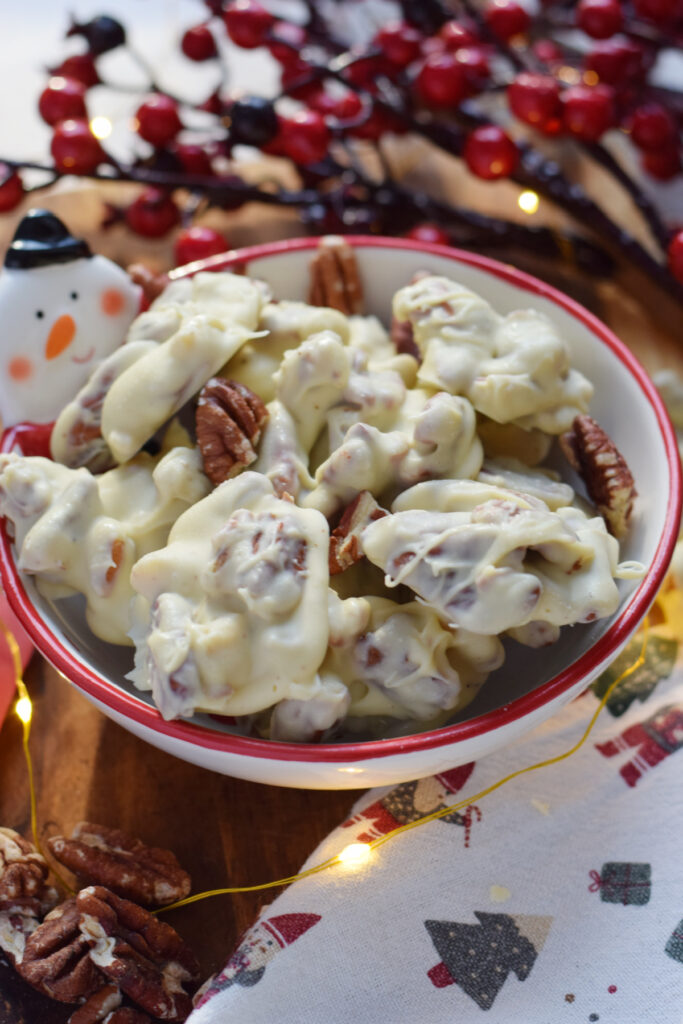 White chocolate with pecans in a bowl.