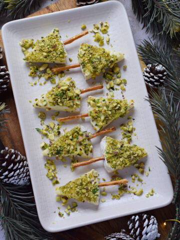 Mini christmas tree appetizers on a plate.